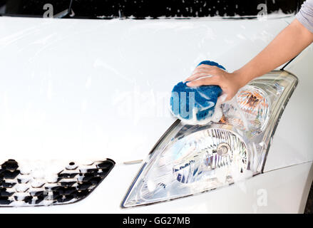 hand using sponge washing car Stock Photo
