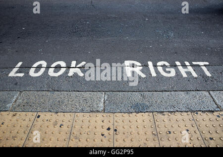 Look Right warning at a pedestrian crossing in a London street.