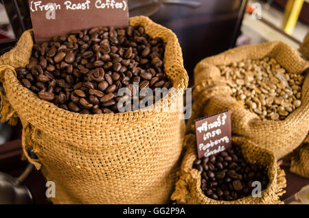 brown and white coffee bean in sack Stock Photo