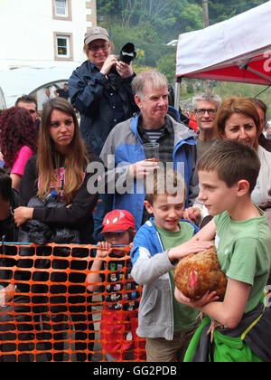 Bonsall World Championship Hen Racing. Young boy waiting to enter his chicken into the contest. Stock Photo