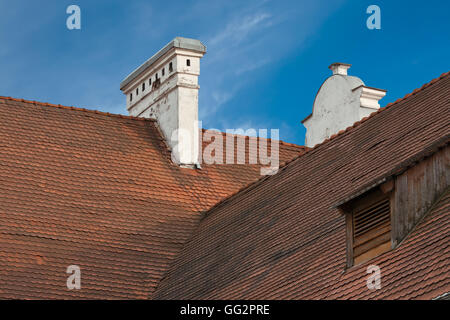 High red tiled roof with chimney and dormer window Stock Photo