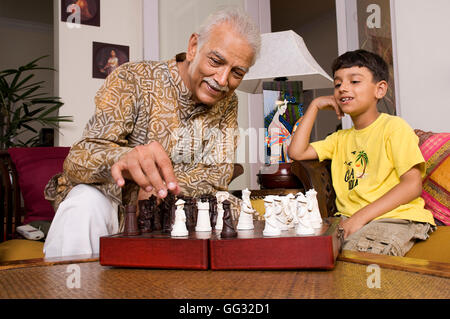 Grandfather playing with grandson Stock Photo