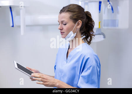 Dental assistant using digital tablet Stock Photo