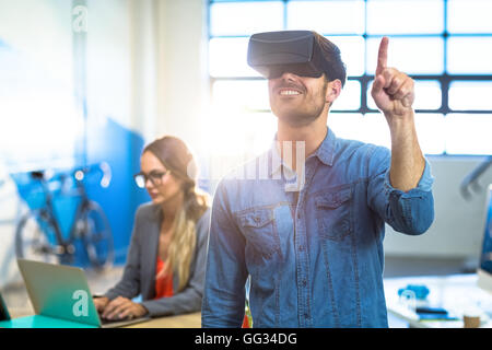 Male graphic designer using the virtual reality headset Stock Photo