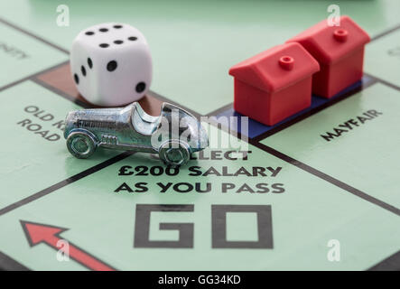 English Edition of Monopoly showing Pass Go,  The classic trading game from Parker Brothers Stock Photo