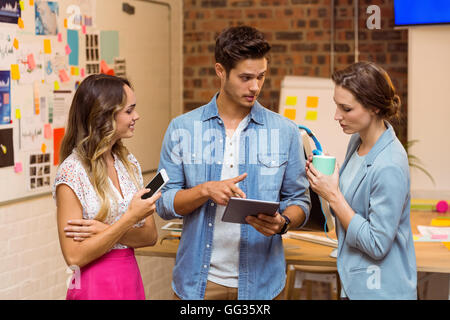 Business people discussing over digital tablet Stock Photo