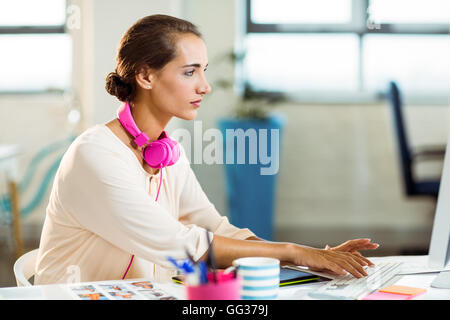 Female graphic designer working on computer Stock Photo