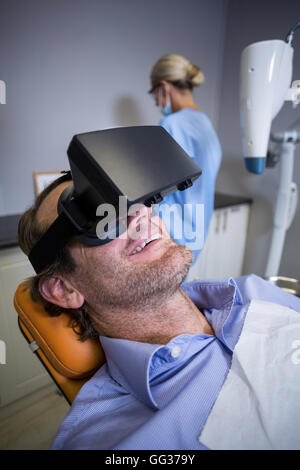 Smiling man using virtual reality Stock Photo
