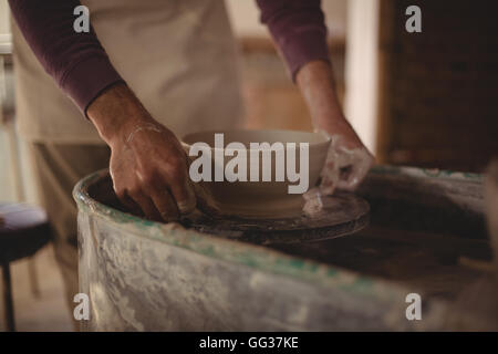 Male potter making bowl Stock Photo - Alamy