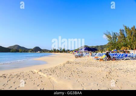 Golden sand beach at Jolly Harbour, south-west Antigua on a sunny day with blue sky Stock Photo