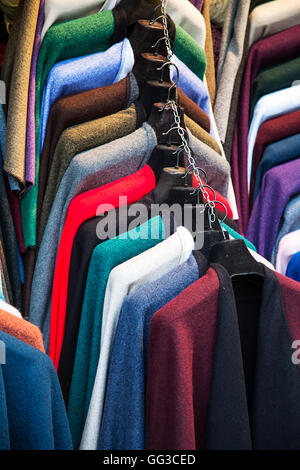 Colorful fashion jackets on hangers Stock Photo