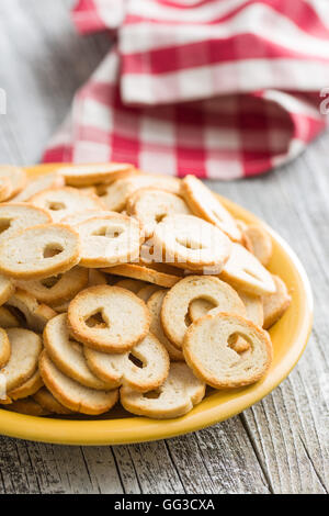 The mini bread chips on a plate. Stock Photo