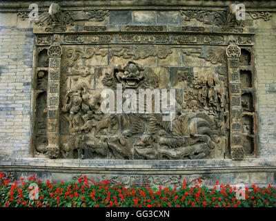 Dragon wall brick relief in the Lion Garden of the Chang Mansion. Stock Photo