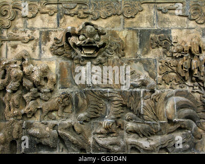 Dragon wall brick relief in the Lion Garden of the Chang Mansion. Stock Photo