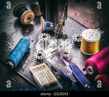 Detail of old sewing machine and sewing accessories Stock Photo