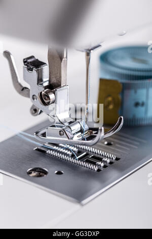 Needle plate, foot and transporter of a sewing machine Stock Photo