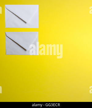 two envelopes on a yellow background Stock Photo