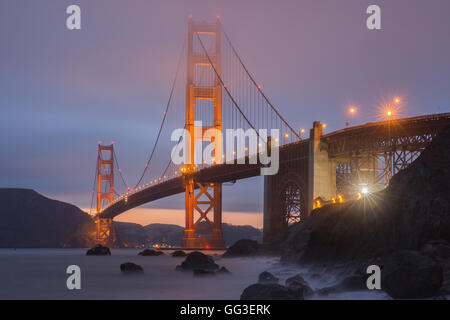 Crack in the clouds behind the Golden Gate Bridge as seen from Marshall's Beach. Stock Photo