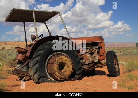 Abandoned farm tractor in desert Stock Photo