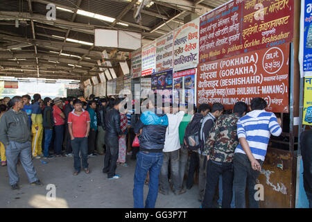 Kathmandu, Nepal - October 22, 2014: People waiting in line at the ticket booth at the bus station Stock Photo