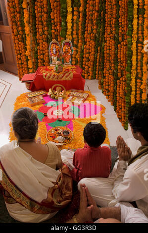 Family praying Stock Photo