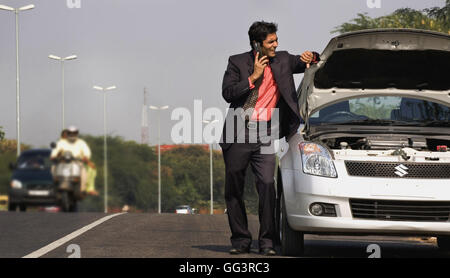 Man with a broken car Stock Photo