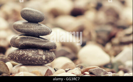 balancing stone tower on the beach Stock Photo