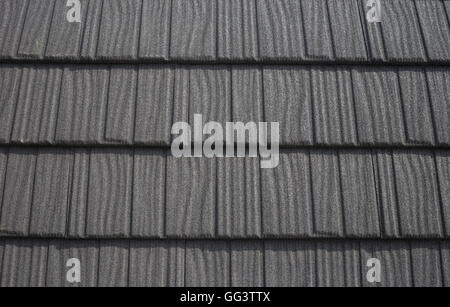 Roof with black bitumen shingles pattern abstract Stock Photo