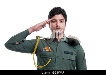 Young security guard saluting over white background Stock Photo