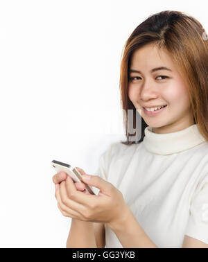 Portrait of Beautiful asian woman using smart phone against white background. Stock Photo