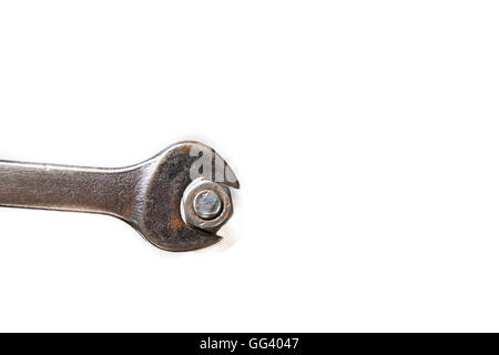 wrench a little rusty and nut on white background Stock Photo