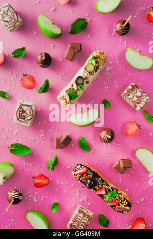 Sweet patterns: popcakes and eclairs Stock Photo