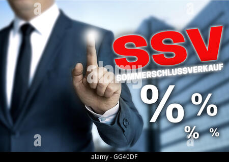 ssv sommerschlussverkauf (in german summer clearance sale) touchscreen is operated by businessman. Stock Photo