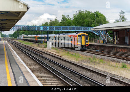 A class 159 diesel express train charges through Winchfield station on the south western mainline heading towards Basingstoke Stock Photo