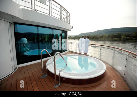 Couple on board river cruise boat with jacuzzi Stock Photo