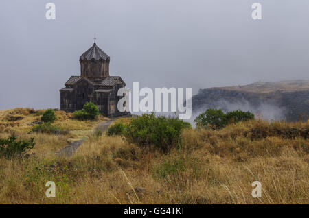 Amberd St. Astvatsatsin (Holy Mother of God) medieval church in slope of Aragats mountain in the clouds. Armenia Stock Photo