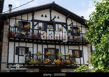 House with lots of flowers on balcony, Picturesque Bera village, Navarre, Northern Spain Stock Photo