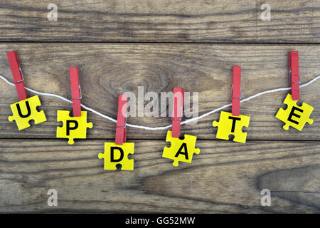 Puzzle pieces with word Update Stock Photo