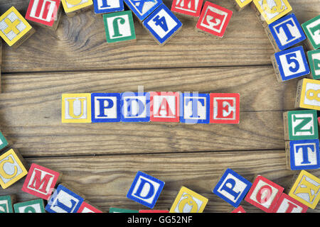 Update word on wooden table Stock Photo