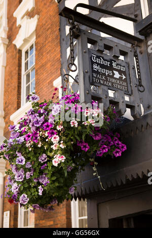 UK, England, Staffordshire, Lichfield, Bore Street, Hanging basket at Tudor Row Shops arcade sign Stock Photo