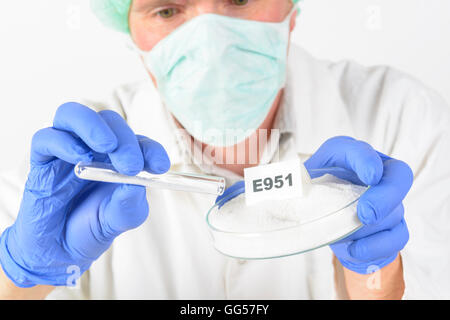 Researcher presenting preservatives substances that are added to products such as foods, pharmaceuticals, paints, biological sam Stock Photo