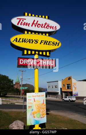 Sign for a Tim Horton's drive-through cafe in St John's, Newfoundland, Canada. The signs advertise the outlet, the fresh coffee Stock Photo