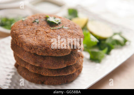 Close-up of delicious cutlets stacked in plate Stock Photo