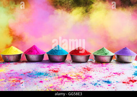Bows of colorful Holi power arranged on floor Stock Photo