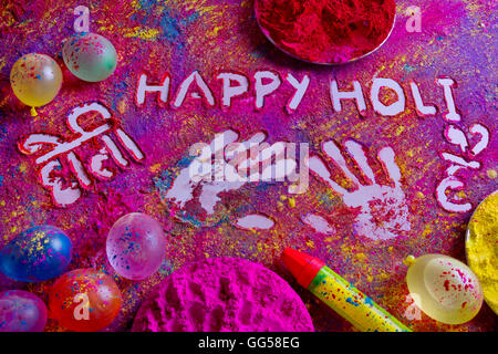 Squirt gun, water bombs and colorful power on rangoli Stock Photo