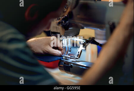 Sewing on the sewing machine - Working close up Stock Photo
