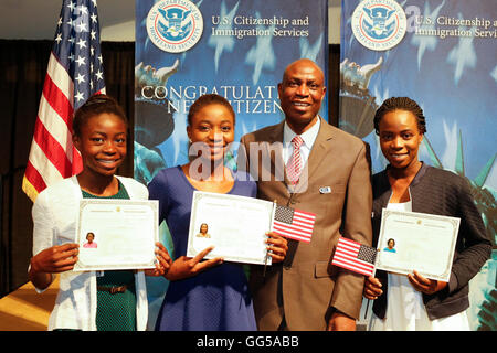 New United States citizens show certificates and pose with family members after naturalization ceremony in San Antonio Texas Stock Photo