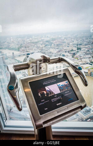 Telescope at the View from the Shard, the tourist attraction at the top of London's tallest skyscraper designed by Renzo Piano. Stock Photo