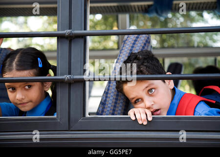 School children sitting in a school bus Stock Photo