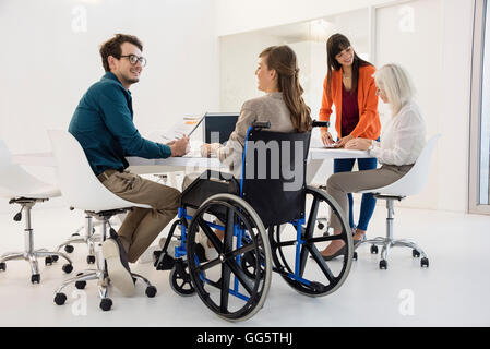 Four business people working in an office Stock Photo